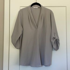 Calvin Klein 3/4 sleeve blouse in light grey with silver buttons on sleeves